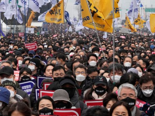 Doctors stage a rally against the government’s plans (Ahn Young-joon/AP)