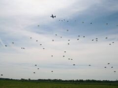 A re-enactment parachute jump of D-Day over Normandy, France, on June 6 2004 (Alamy/PA)