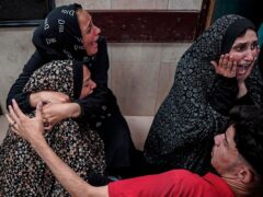 Palestinians mourn a relative killed in the Israeli bombardment of the Gaza Strip (Saher Alghorra/AP)