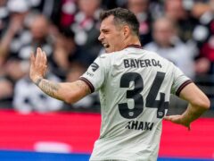 Bayer Leverkusen’s Granit Xhaka celebrates his side’s opening goal against Frankfurt (Michael Probst/AP)