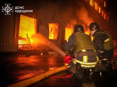 Emergency services personnel work to extinguish a fire following a Russian attack in Odesa (Ukrainian Emergency Service via AP)