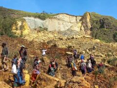 Villagers search through a landslide in Yambali village in the Highlands of Papua New Guinea (Kafuri Yaro/UNDP Papua New Guinea via AP)