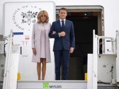 French President Emmanuel Macron and his wife Brigitte arrive at a military airfield near Berlin (Christophe Gateau/dpa/AP)
