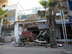 A collapsed building is fenced off in Palma de Majorca, Spain (Francisco Ubilla/AP)
