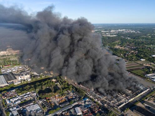 A fire burns at a vast shopping complex in Warsaw (Norbert Ofmanski/AP)