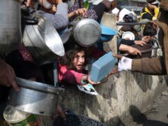 Palestinians line up for food in Rafah (AP Photo/Hatem Ali, File)