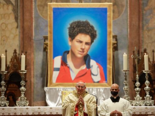 A picture of Carlo Acutis is displayed during his beatification ceremony in 2020 (Gregorio Borgia/AP)