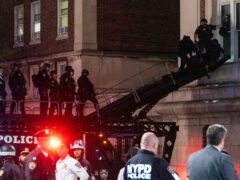 Hundreds of New York City police swept into Columbia University on Tuesday night to end a pro-Palestinian occupation of an administration building and sweep away a protest encampment (Craig Ruttle/AP)