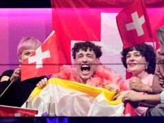 Nemo of Switzerland who performed the song The Code celebrates as the judges votes start to be announced (Martin Meissner/AP)