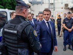 French President Emmanuel Macron visits the central police station in Noumea, New Caledonia (Ludovic Marin/AP)