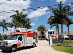 A U-Haul is seen leaving Sean Kingston’s rented mansion on Thursday (Amy Beth Bennett/South Florida Sun-Sentinel via AP)