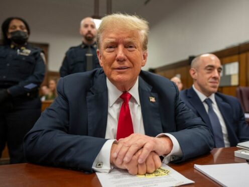 Former US pesident Donald Trump sits with lawyers while he attends his trial at Manhattan Criminal Court in New York City (Steven Hirsch/New York Post via AP, Pool)