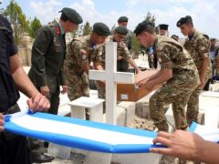 The remains of 15 recently identified Greek soldiers who fought in Cyprus against invading Turkish troops in July 1974 have been returned to their families (Philippos Christou/AP)