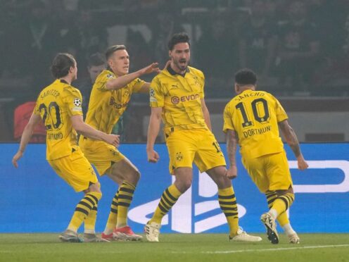 Mats Hummels, second right, celebrates with his team-mates (Frank Augstein/AP)