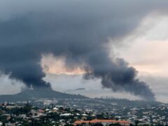 Smoke rises during protests in Noumea, New Caledonia (Nicolas Job/AP)