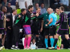 Bayern Munich players argue with referee Szymon Marciniak (Manu Fernandez/AP)