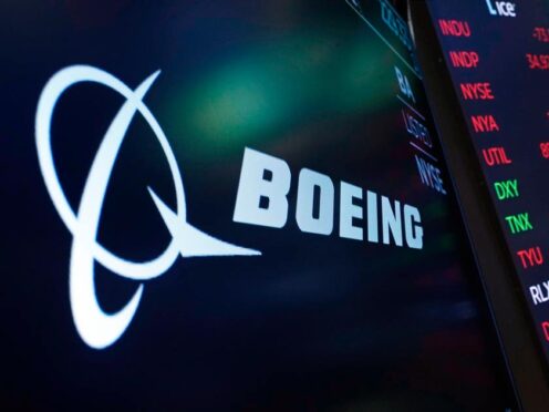 The logo for Boeing appears on a screen above a trading post on the floor of the New York Stock Exchange (Richard Drew/AP, file)