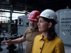 German’s foreign minister Annalena Baerbock speaks to Ukrainian energy minister Herman Halushchenko on a visit to a thermal power plant which was destroyed by a Russian rocket attack in Ukraine (AP Photo/Evgeniy Maloletka)