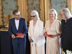 Bjorn Ulvaeus, Anni-Frid Lyngstad, Agnetha Fältskog and Benny Andersson received the Royal Vasa Order (Henrik Montgomery/TT News Agency via AP)
