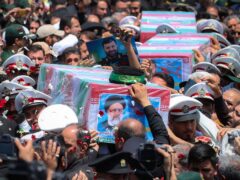 The coffins of Ebrahim Raisi and his companions were carried through the city of Mashhad (Iranian Presidency Office via AP)