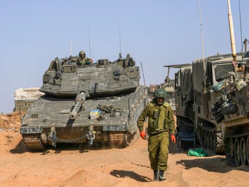 Israeli soldiers at a staging ground near the border with the Gaza Strip (Tsafrir Abayov/AP)