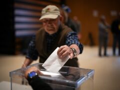 An early voter casts his ballot for Catalonia’s regional elections in La Roca del Valles, north of Barcelona (Emilio Morenatti/AP)