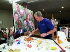 Former president George W Bush working on a portrait of service members and veterans (George W Bush Presidential Centre via AP)