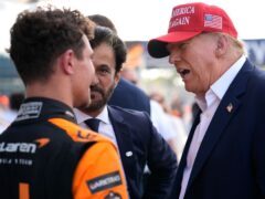 Former US president Donald Trump, right, talks Lando Norris after the Miami Grand Prix (Rebecca Blackwell/AP)