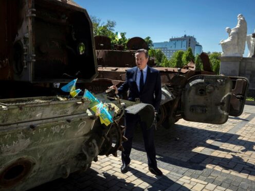 Foreign Secretary Lord David Cameron walks past a display of destroyed Russian military vehicles in Saint Michael’s Square, in Kyiv (Thomas Peter/Pool via AP)