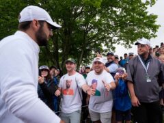 Scottie Scheffler is greeted by fans after the second round of the US PGA Championship at Valhalla (Matt York/AP)