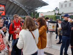 Fans drank outside Court Phillipe Chatrier after French Open bosses banned beer in the stands (Jean-Francois Badias/AP)