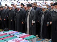 Iranian Supreme Leader Ayatollah Ali Khamenei, centre with black turban, leads a prayer over the flag-draped coffins of the late President Ebrahim Raisi and his companions who were killed in a helicopter crash (AP)