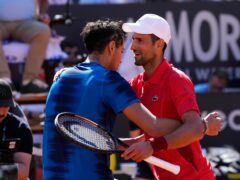 Serbia’s Novak Djokovic (right) hugs Chile’s Alejandro Tabilo after their match at the Italian Open (Alessandra Tarantino/AP)