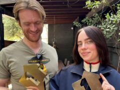 Billie Eilish and Finneas with their number one awards for Hit Me Hard And Soft (Official Charts/PA)