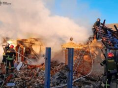 Rescuers work at a damaged building after a Russian missile attack in Kyiv region, Ukraine (Ukrainian Emergency Service/AP)