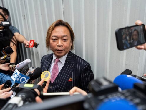 Former pro-democracy district councillor Lawrence Lau was acquitted by the court (Chan Long Hei/AP)