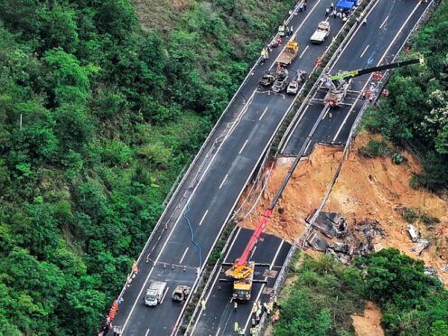 An aerial photo shows rescuers work at the site of a collapsed road section of the Meizhou-Dabu Expressway in Meizhou, south China’s Guangdong Province (Xinhua News Agency via AP)