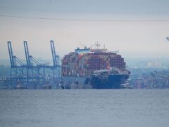Crews are working to move the cargo ship Dali (AP)
