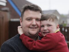 Mairtin Mac Gabhann with his seven-year-old son Daithi Mac Gabhann (Liam McBurney/PA)