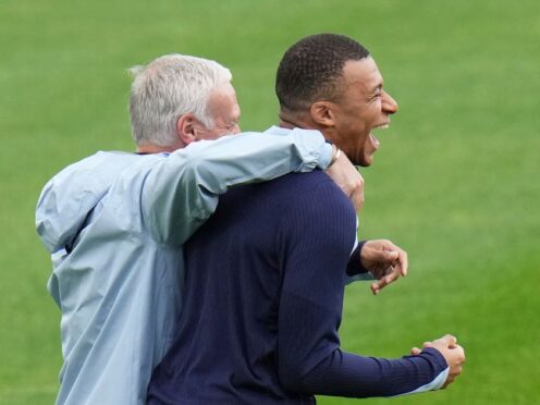 Didier Deschamps, left, with Kylian Mbappe during training (Hassan Ammar/AP)