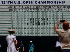 Fans gather around the main scoreboard during a practice round for the 124th US Open at Pinehurst (Matt York/AP)