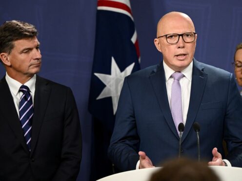Opposition Leader Peter Dutton unveils details of proposed nuclear energy plan as Shadow Treasurer Angus Taylor, left, looks on during a press conference (Bianca de Marchi/AP)