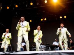 Alexander Morris performing on stage with the Four Tops (Amy Harris/Invision/AP)