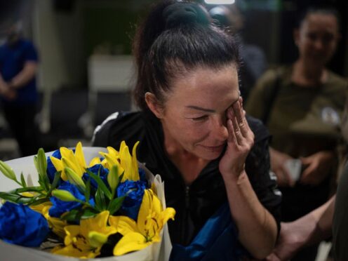 Olena Pekh cries while she speaks to her daughter via a video call in Kyiv (Alex Babenko)