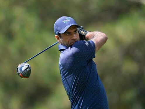 Aaron Rai hits off the fourth tee during the first round of the Rocket Mortgage Classic (Paul Sancya/AP)