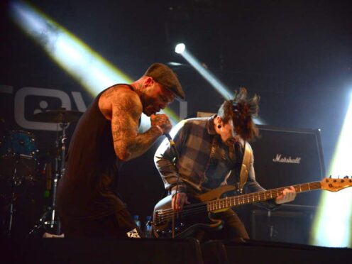 Seth Binzer (left) playing at the Download Festival with Crazy Town in 2014 (Lewis Stickley/PA)