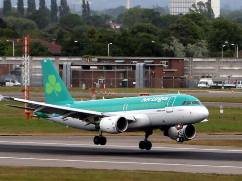 An Aer Lingus plane lands at Heathrow Airport in London (Steve Parsons/PA)