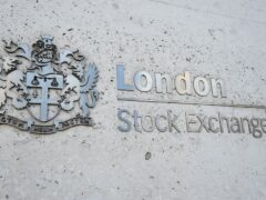 The FTSE 100 Index closed lower (PA)