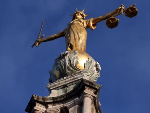 Pomeroy’s Statue of Justice stands on top of the Central Criminal Court building, Old Bailey (Jonathan Brady/PA)