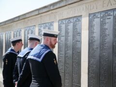 Royal Navy ratings look at the names on one of the panels on the Portsmouth Naval memorial in Southsea (Andrew Matthews/PA)